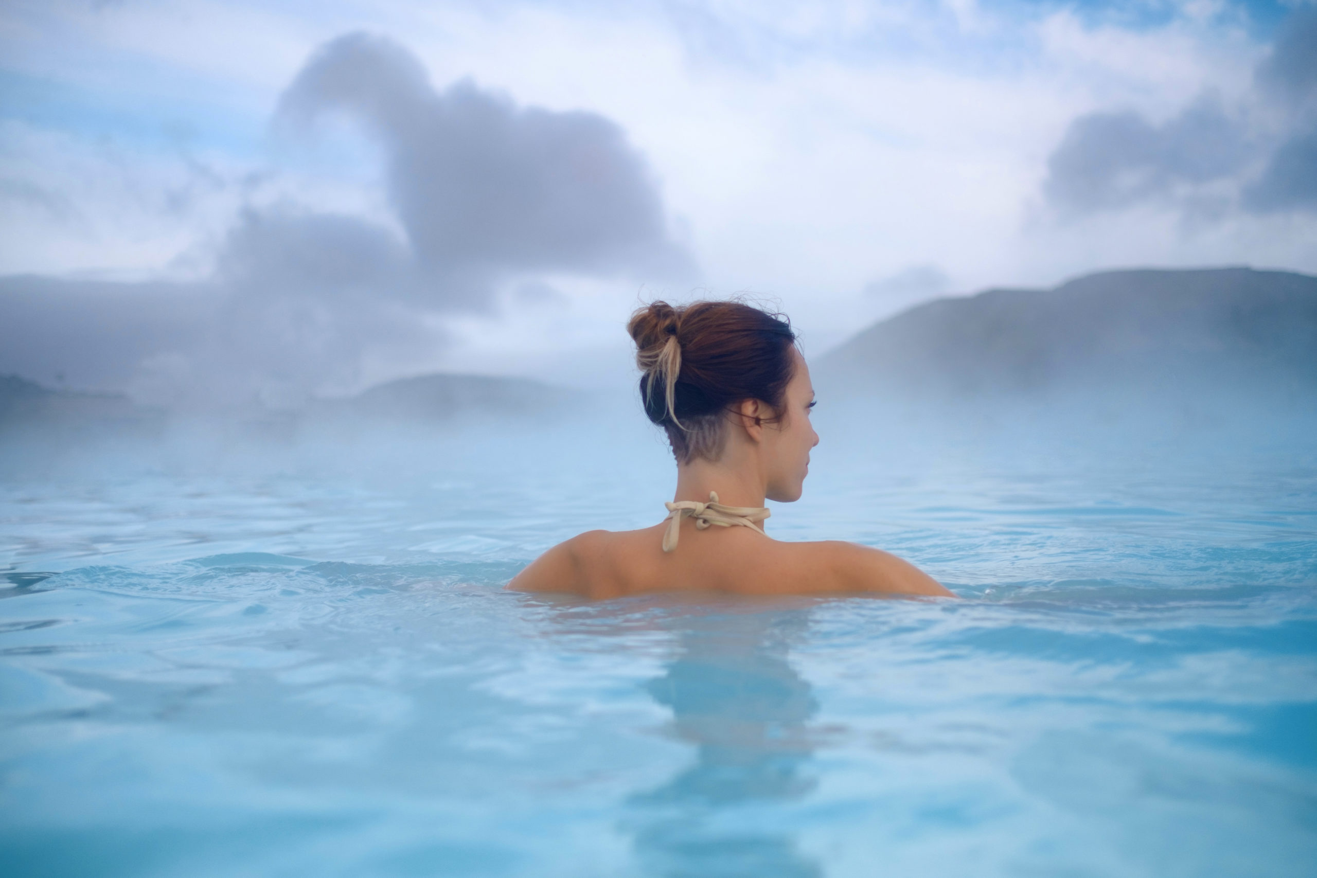 woman enjoys spa in geothermal hot spring ph67tk7 scaled - beauty salons near me directory